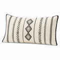 Cojín lumbar 50 x 30 cm de tejido beige y negro con motivos geométricos - acabado con borlas